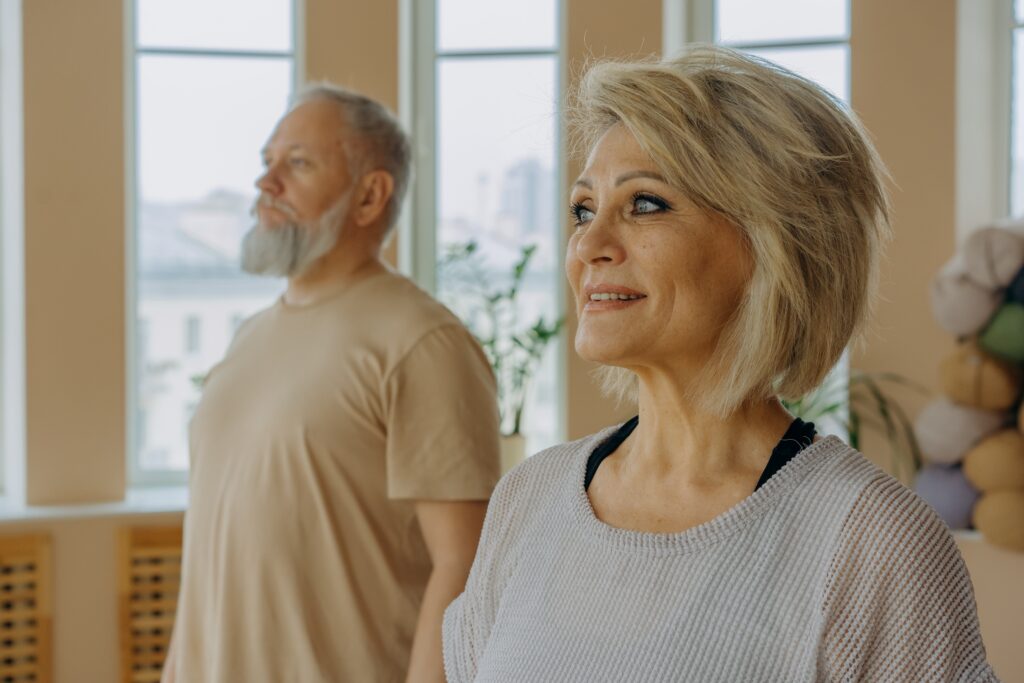 Older woman and man indoor exercise